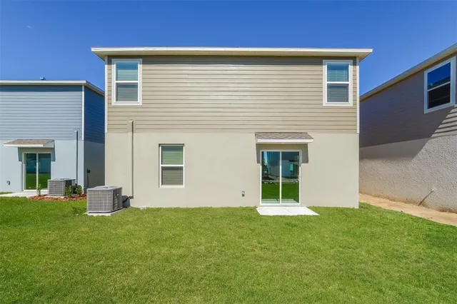 a view of a backyard of the house