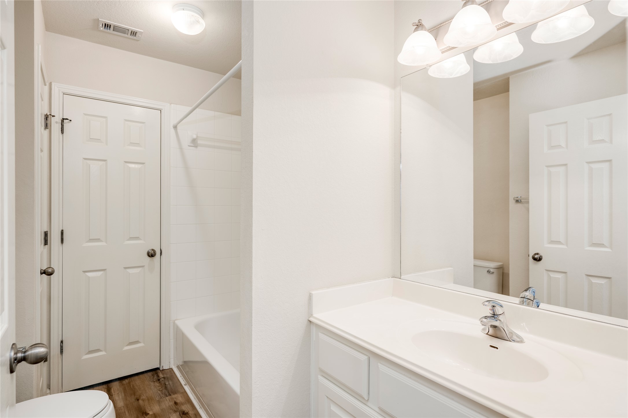 1813 Nelson Ranch Loop Cedar Park, TX 78613 - Photo 23 of 39 A well-lit primary bathroom featuring a spacious vanity with an integrated sink and large mirror.