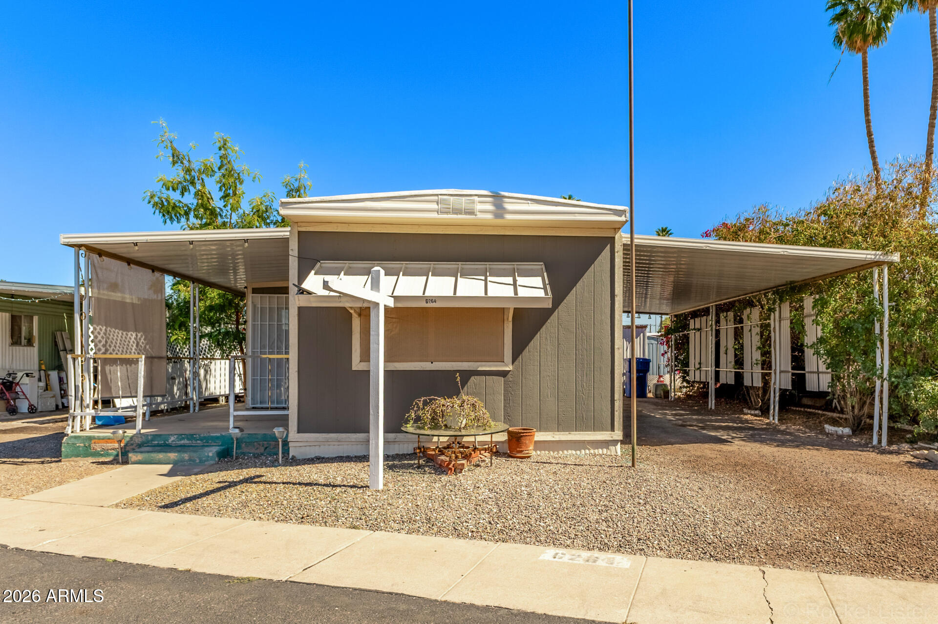 5201 West Camelback Road, Unit G264 Phoenix, AZ 85031 - Photo 1 of 16 a view of a house with a patio
