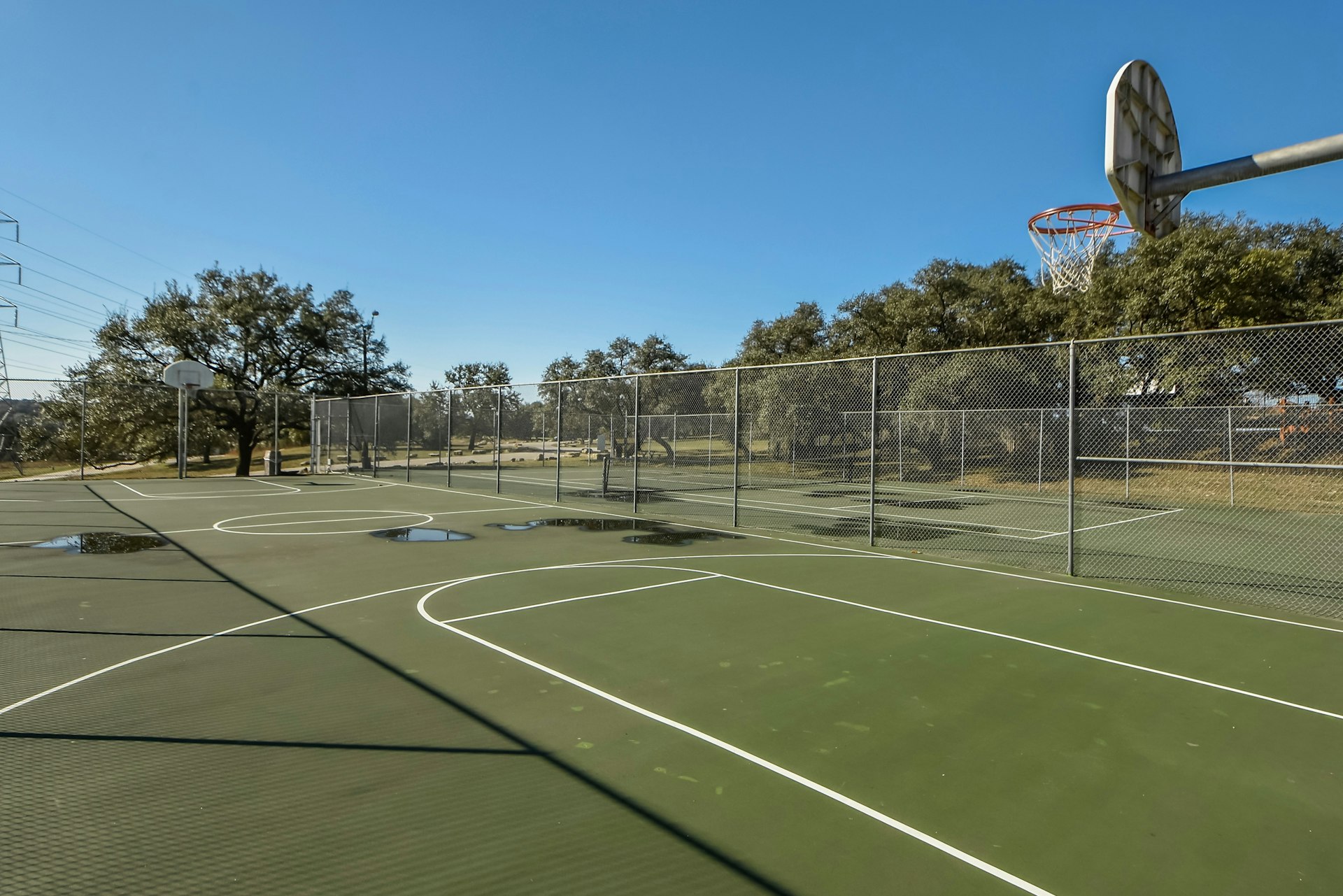 14922 Running Deer Trail Austin, TX 78734 - Photo 9 of 31 View of basketball court featuring community basketball court and fence