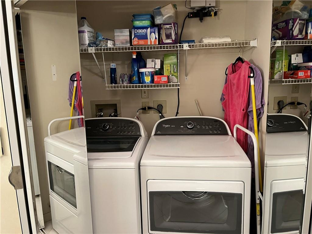 8673 Sunbird Place Boca Raton, FL 33496 - Photo 24 of 28 a utility room with dryer and washer