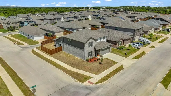 an aerial view of residential houses with outdoor space