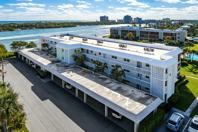 a bedroom with furniture and a large window