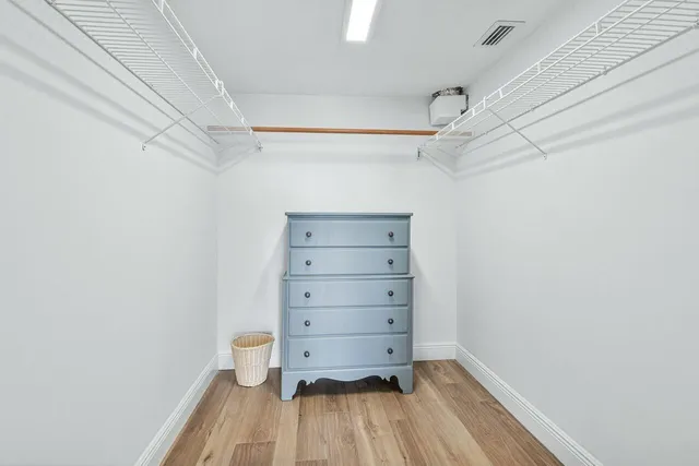 a bedroom with bed and window