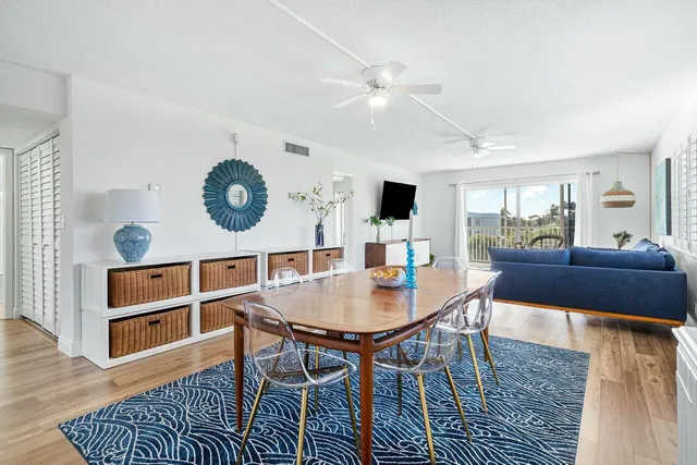 a kitchen with cabinets stainless steel appliances and a counter space