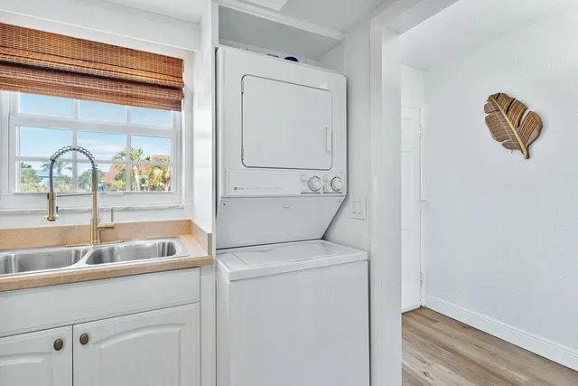 a kitchen with a sink and a refrigerator