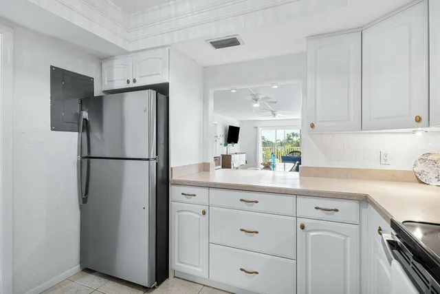 a view of a building with cars