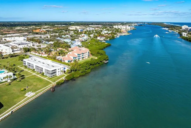an aerial view of a house with a lake view