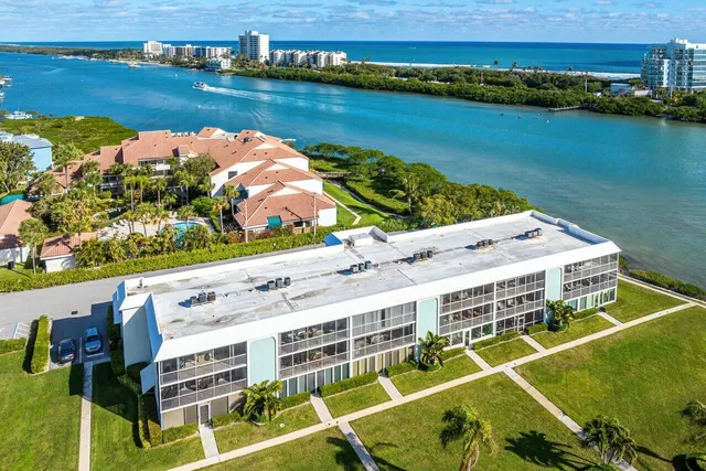 an aerial view of a house with outdoor space