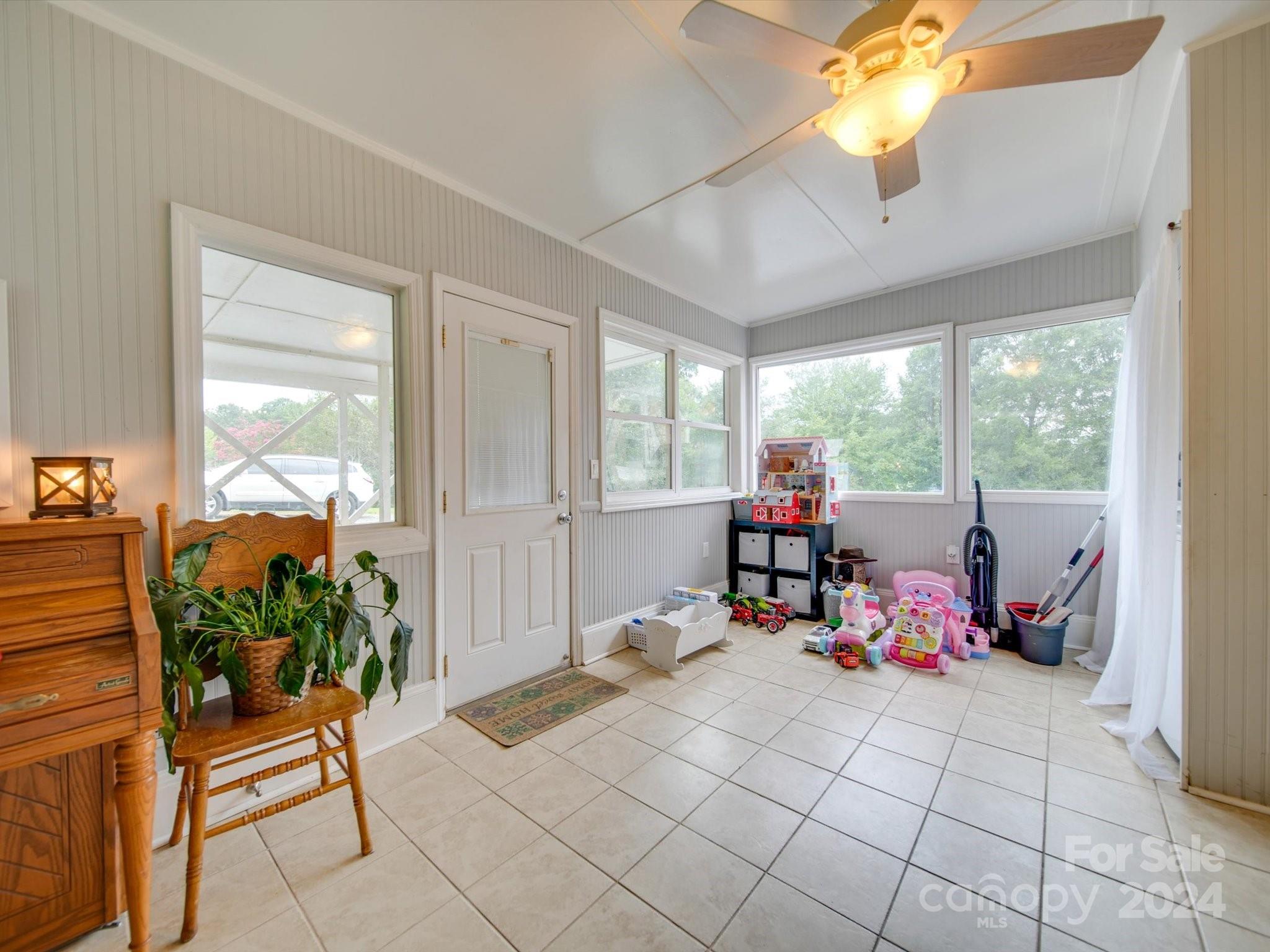 3802 White Store Road Wingate, NC 28174 - Photo 11 of 23 a room with furniture and a potted plant