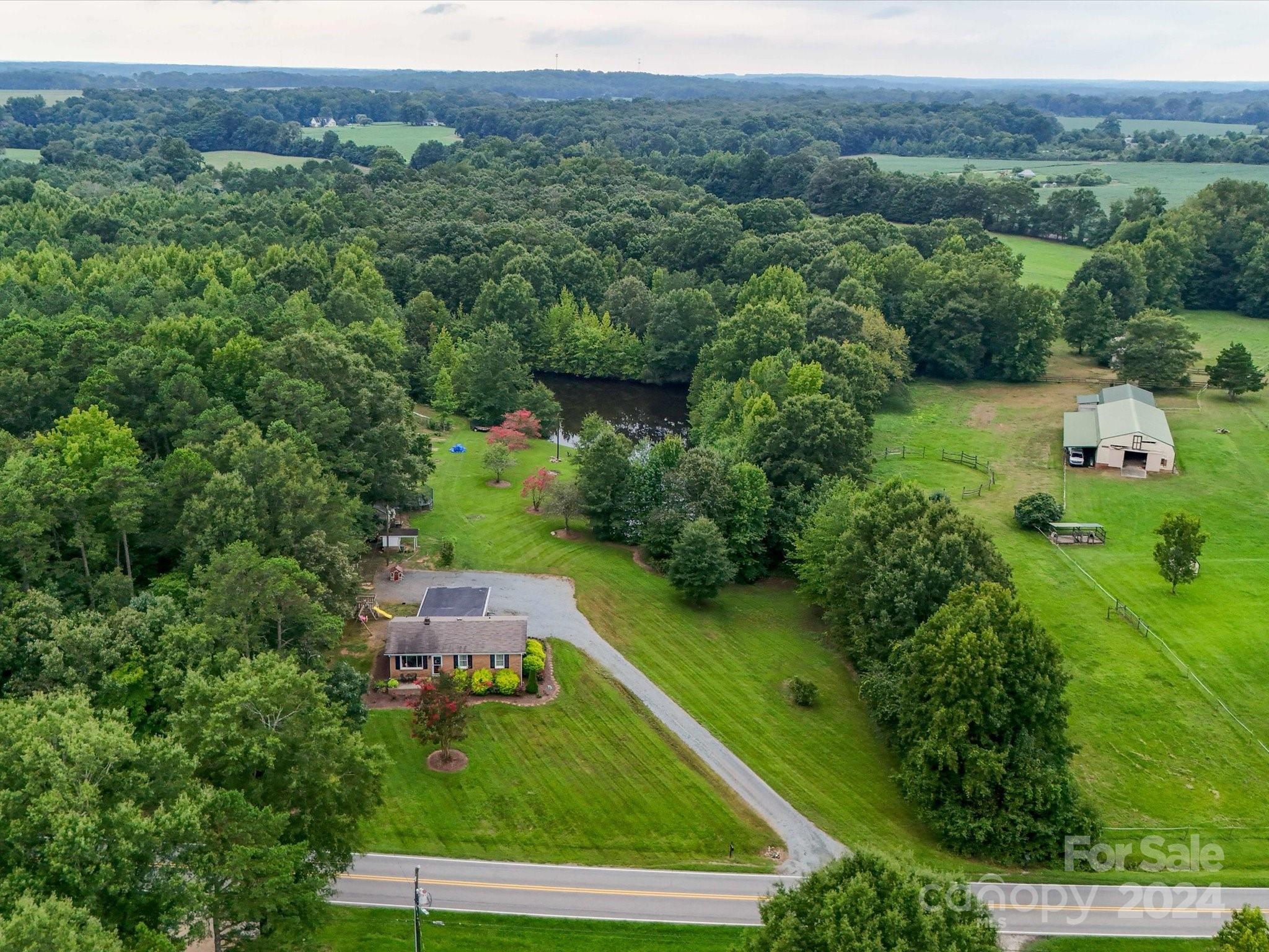 3802 White Store Road Wingate, NC 28174 - Photo 19 of 23 an aerial view of a house with pool yard and outdoor seating