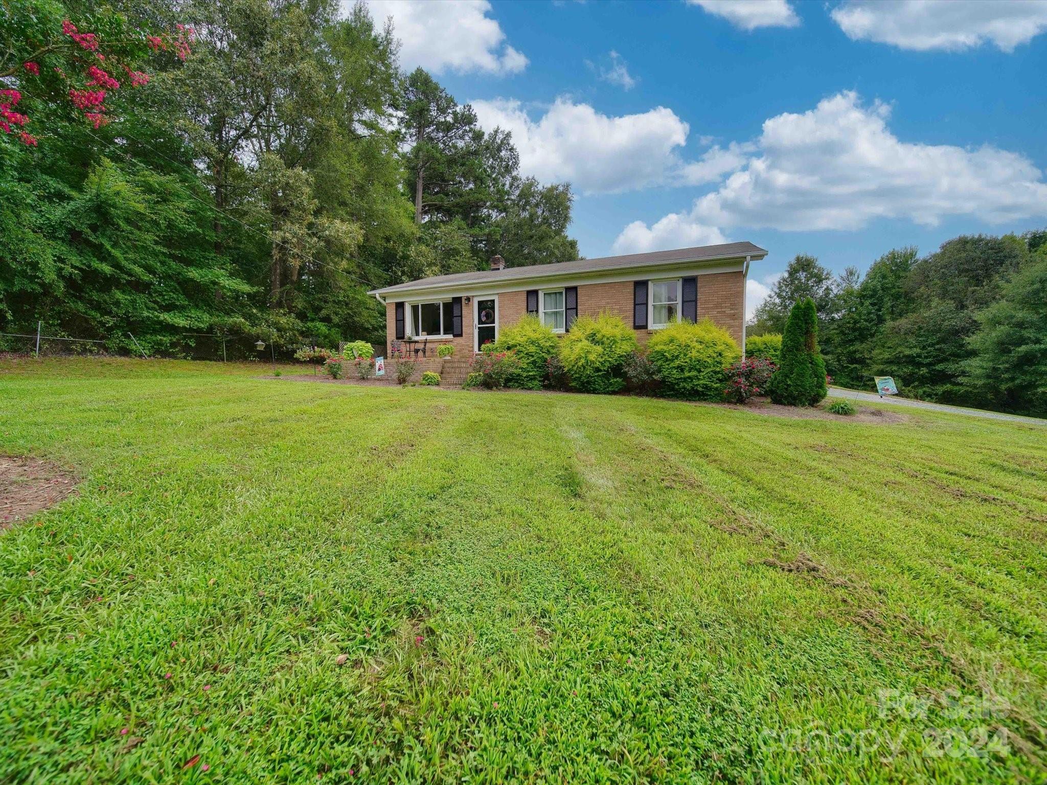 3802 White Store Road Wingate, NC 28174 - Photo 2 of 23 a view of a house with a big yard