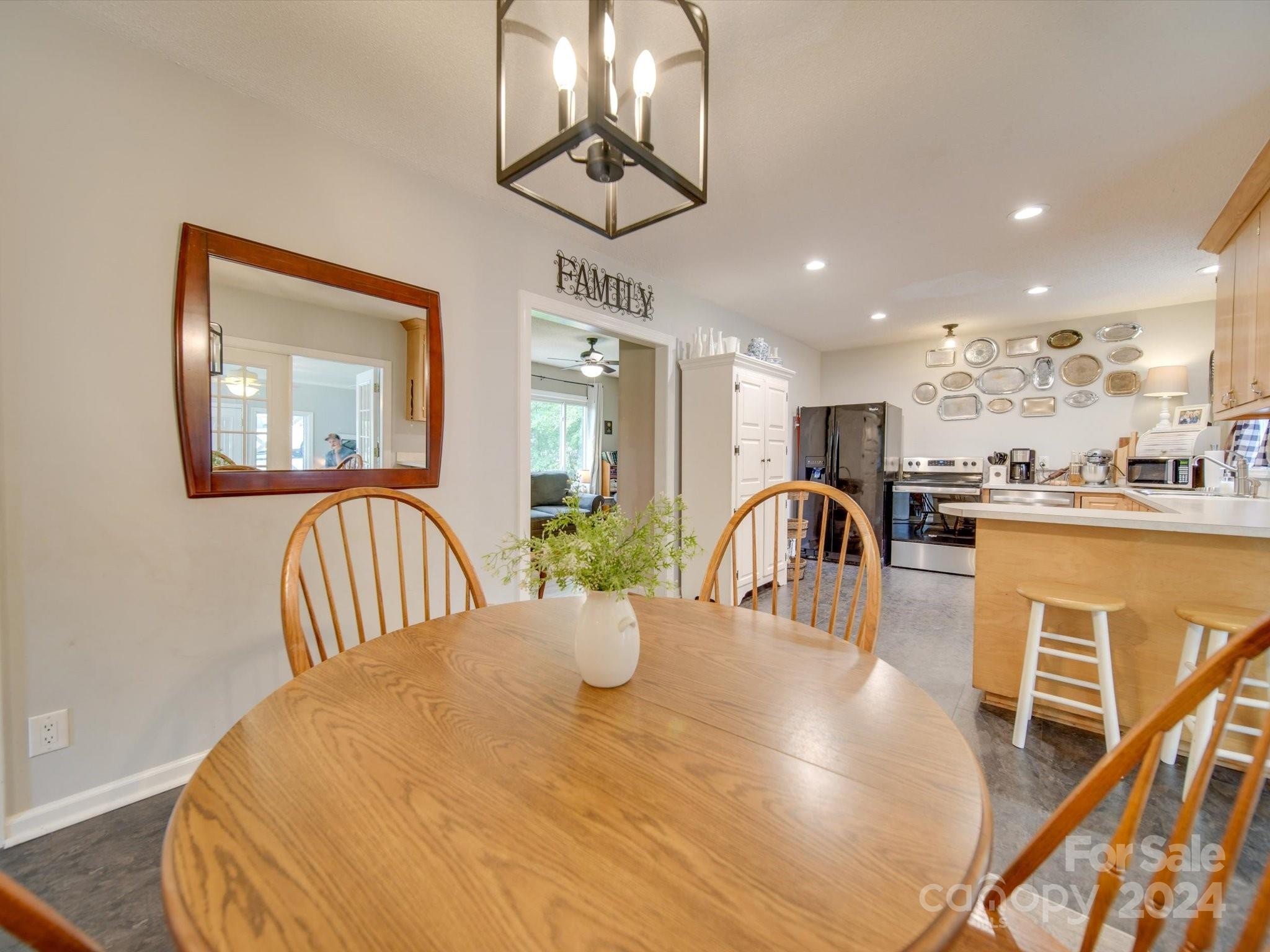 3802 White Store Road Wingate, NC 28174 - Photo 7 of 23 a view of a dining room with furniture window and wooden floor