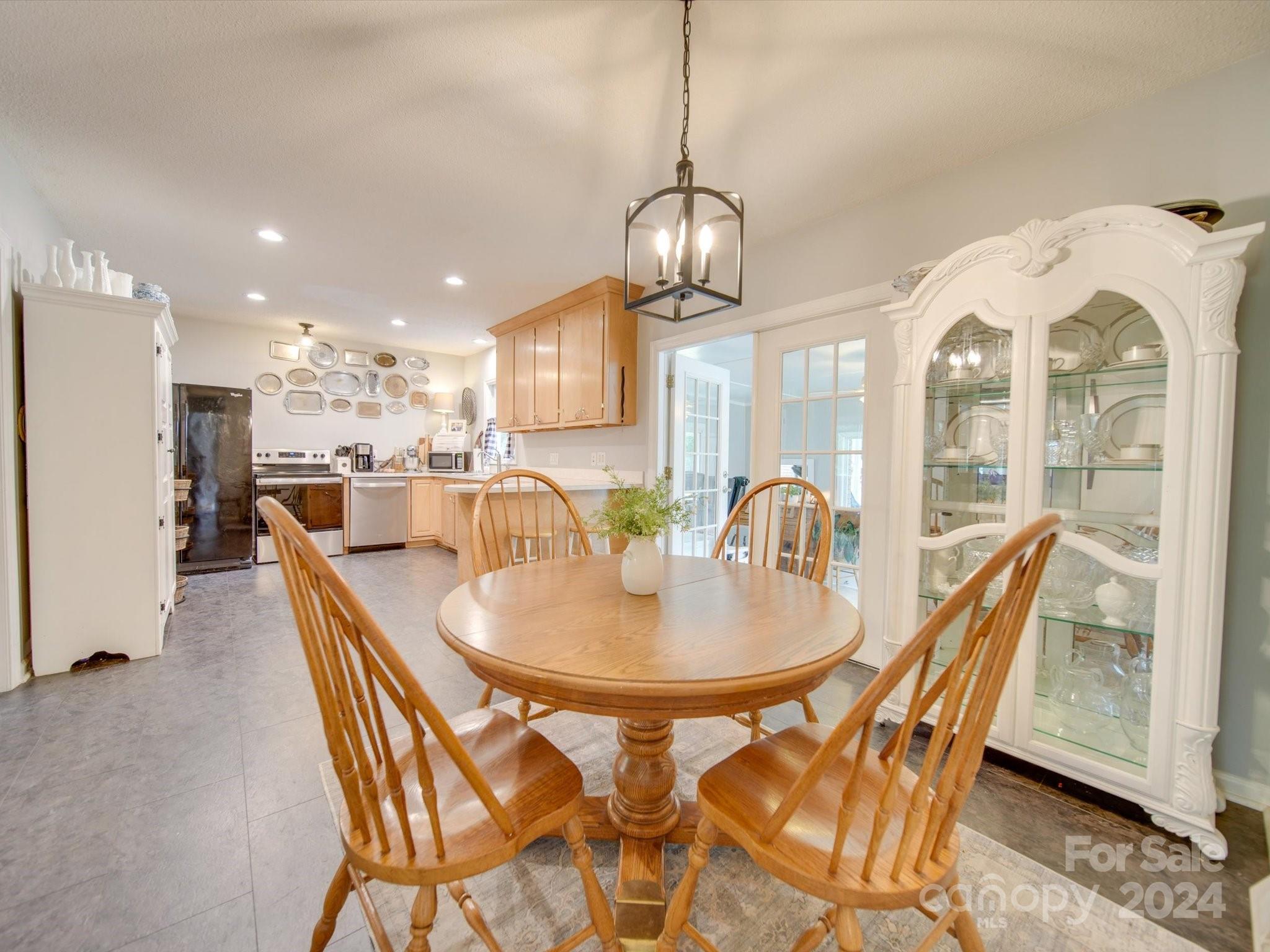 3802 White Store Road Wingate, NC 28174 - Photo 8 of 23 a dining room with furniture a chandelier and wooden floor
