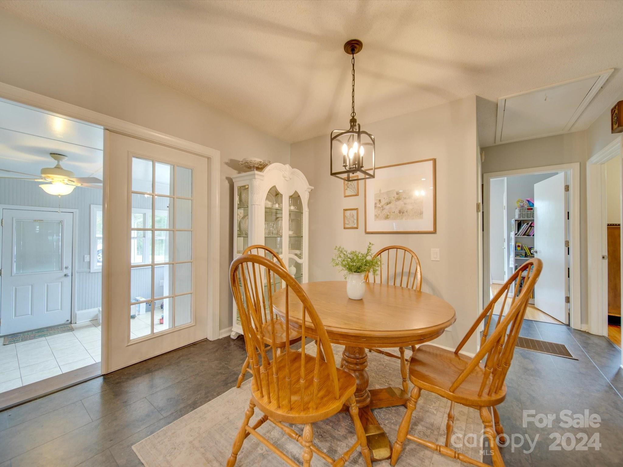 3802 White Store Road Wingate, NC 28174 - Photo 9 of 23 a view of a dining room with furniture wooden floor and chandelier