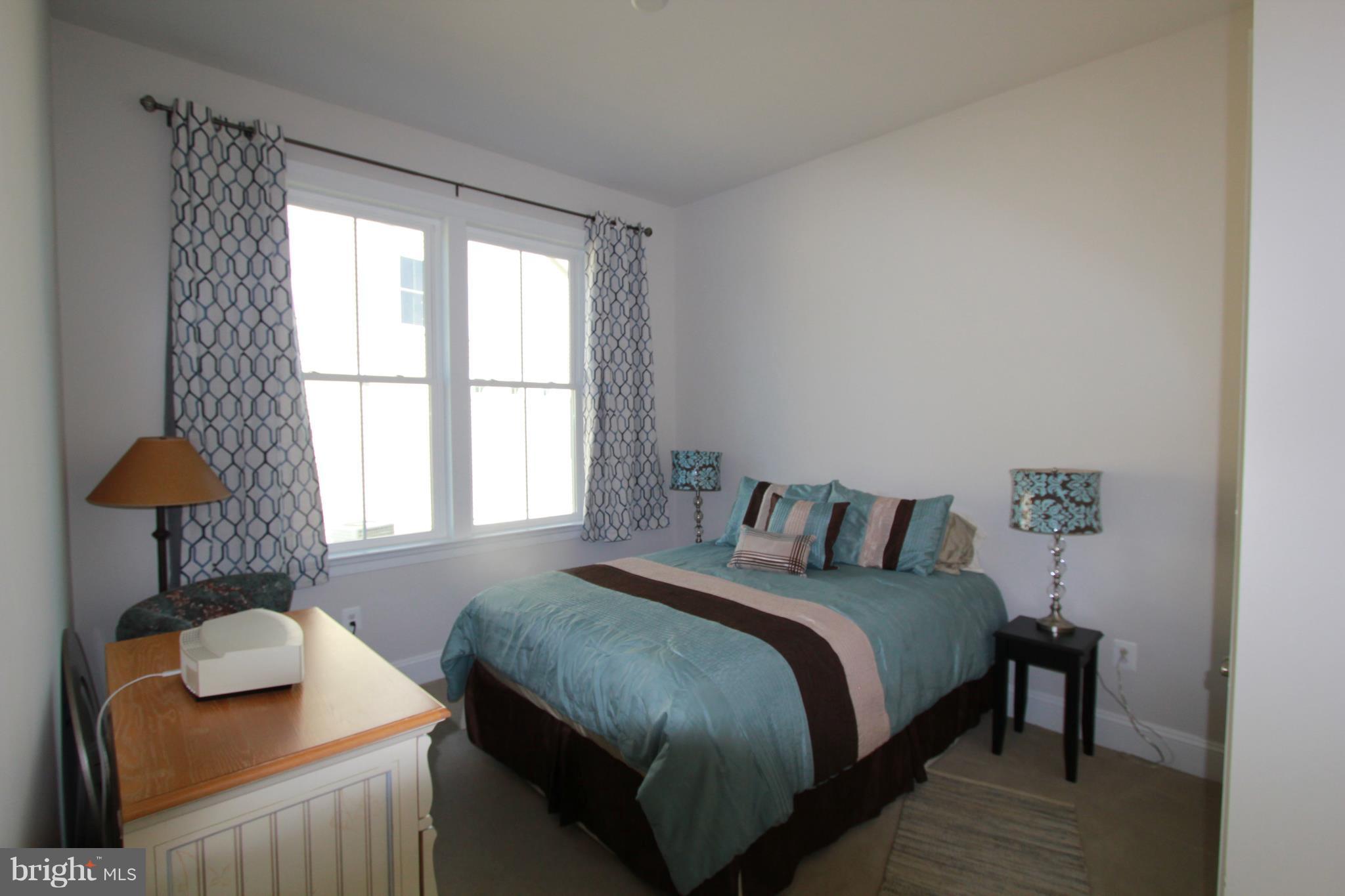 2972 Levee Drive Odenton, MD 21113 - Photo 15 of 30 a bedroom with a bed and a lamp