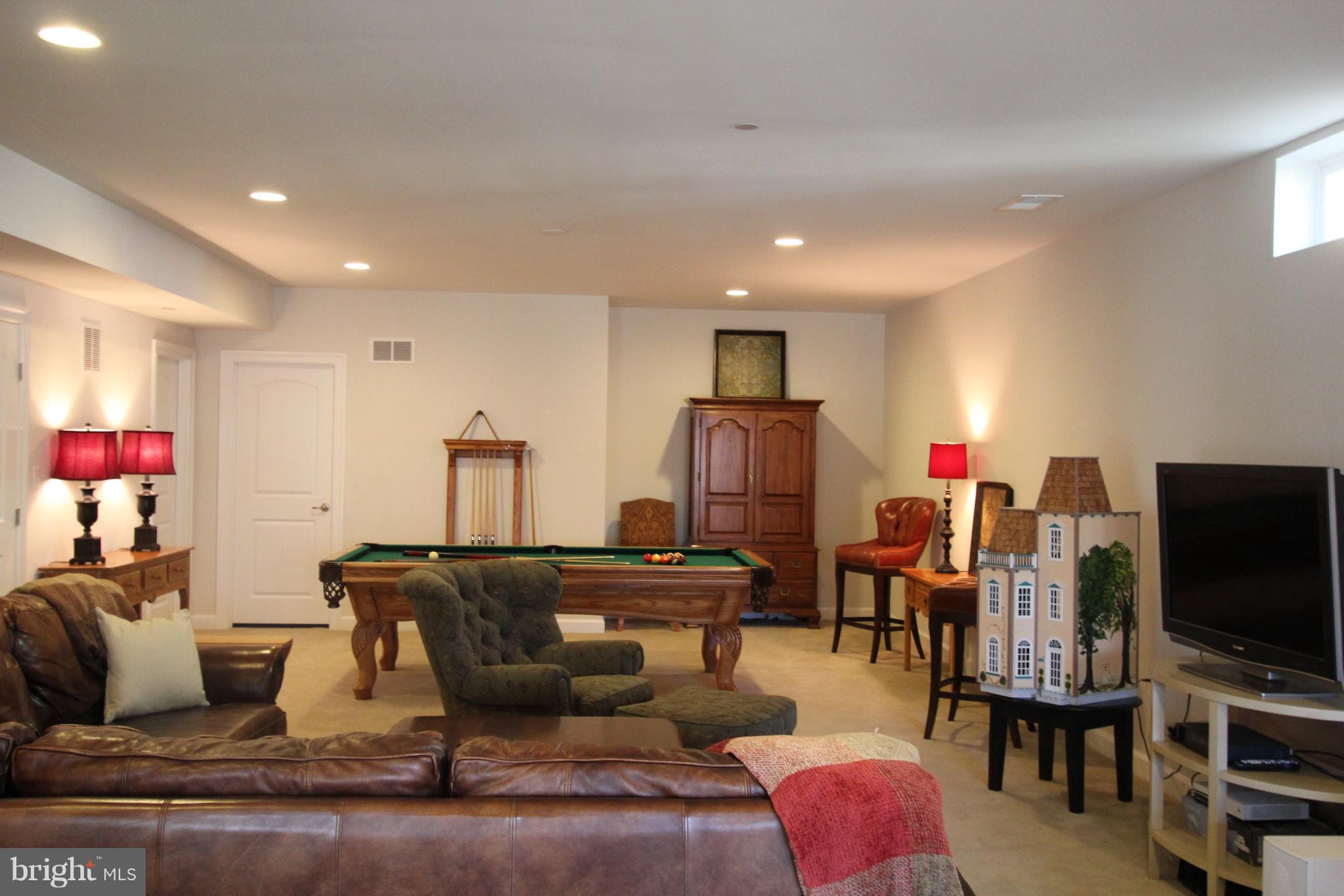 2972 Levee Drive Odenton, MD 21113 - Photo 21 of 30 a living room with furniture and a flat screen tv
