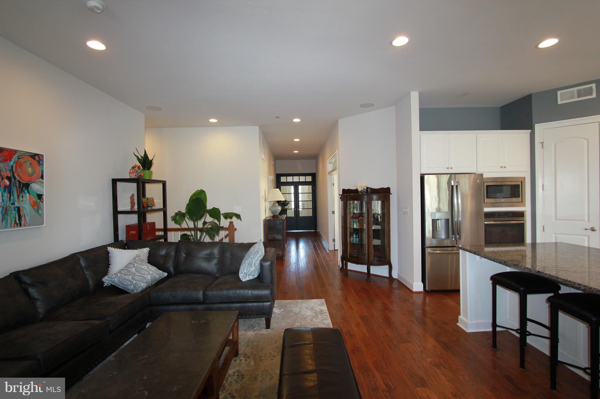 2972 Levee Drive Odenton, MD 21113 - Photo 6 of 30 a living room with stainless steel appliances furniture refrigerator and a wooden floor
