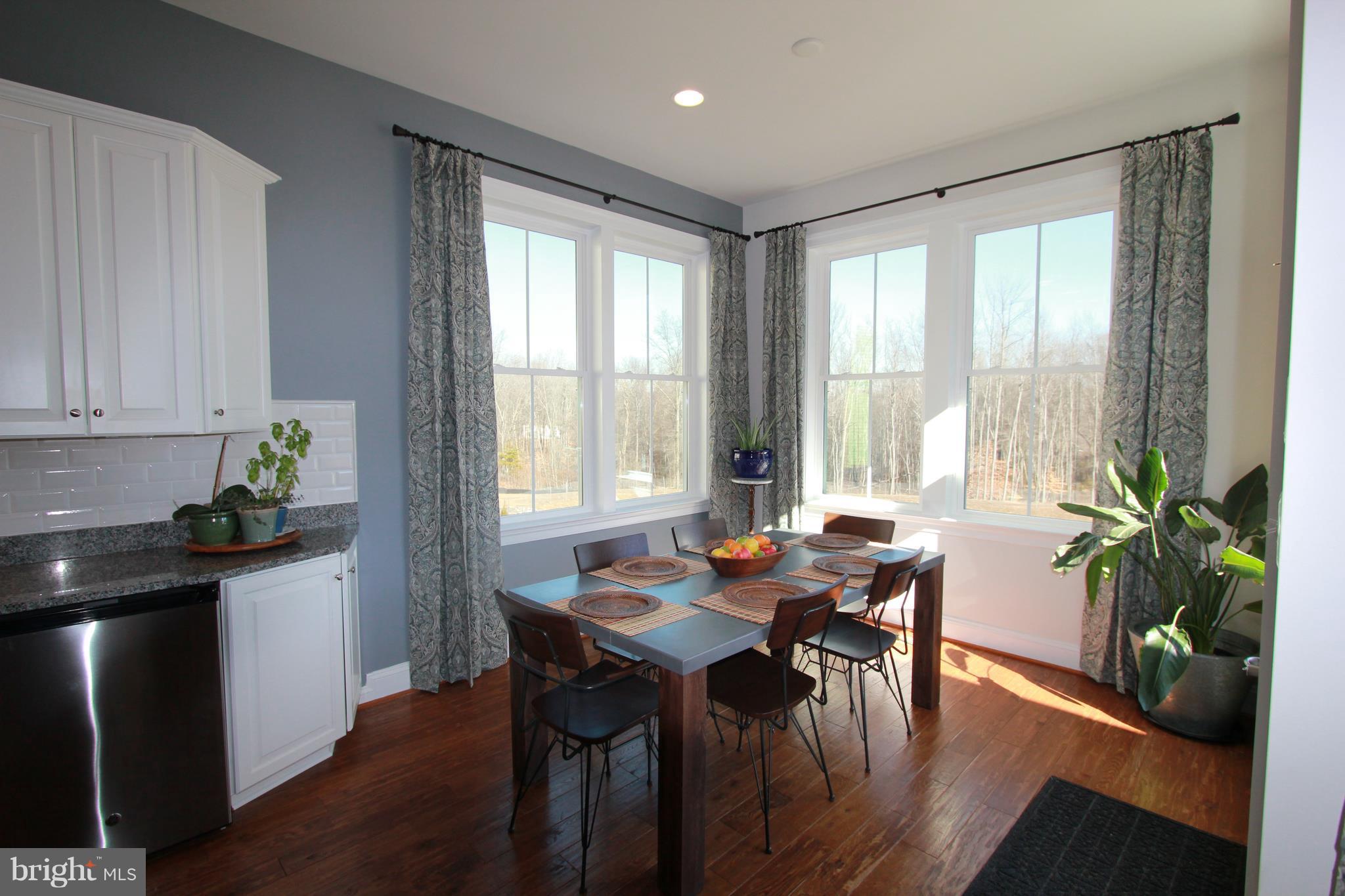 2972 Levee Drive Odenton, MD 21113 - Photo 8 of 30 a view of a dining room with furniture window and wooden floor