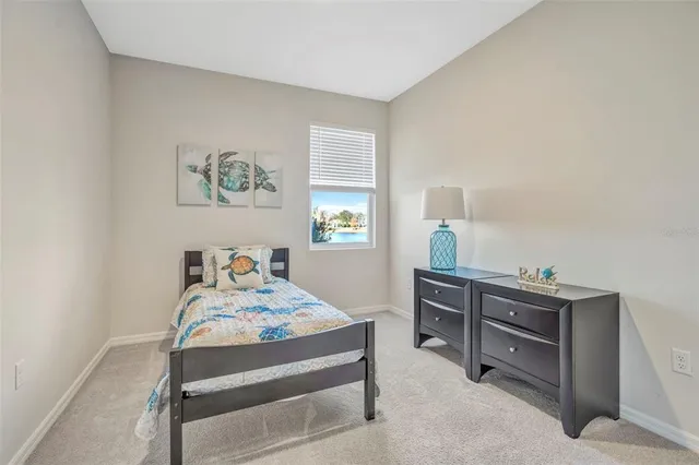 a bedroom with a bed and a dresser in it