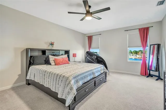 a view of walk in closet with clothes
