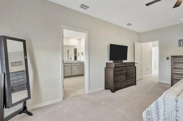 a bathroom with a granite countertop sink and a bathtub