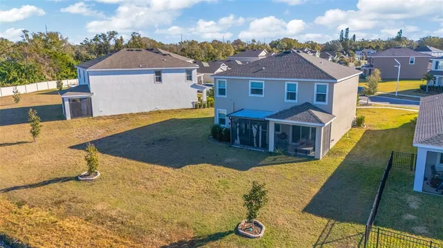 an aerial view of a house with outdoor space