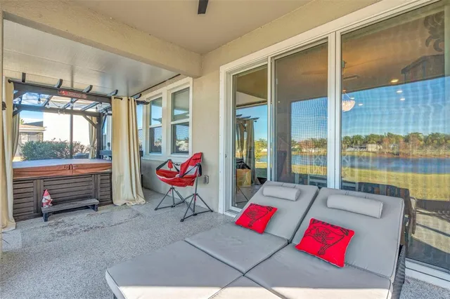 a view of a swimming pool with an outdoor space and seating area