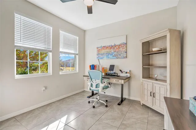 a work room with furniture and windows