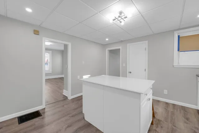 a kitchen with a table and chairs