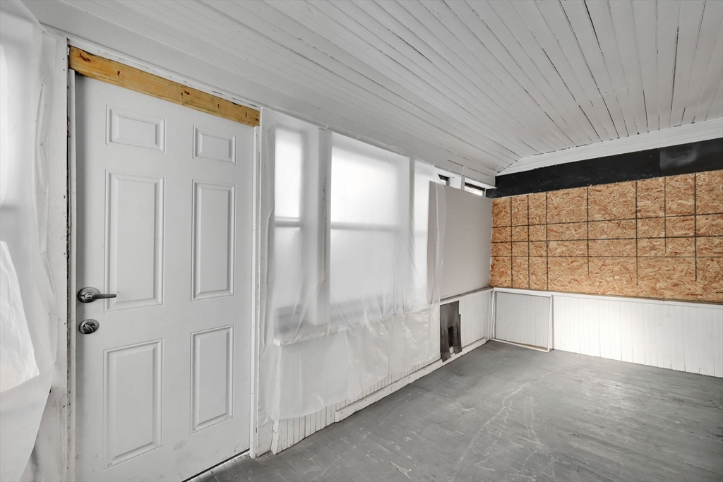 140-142 Dickinson Street Springfield, MA 01108 - Photo 27 of 42 a view of an empty room with a window