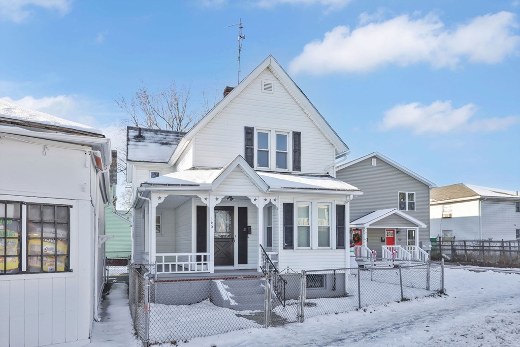 140-142 Dickinson Street Springfield, MA 01108 - Photo 3 of 42 a view of a white house with large windows