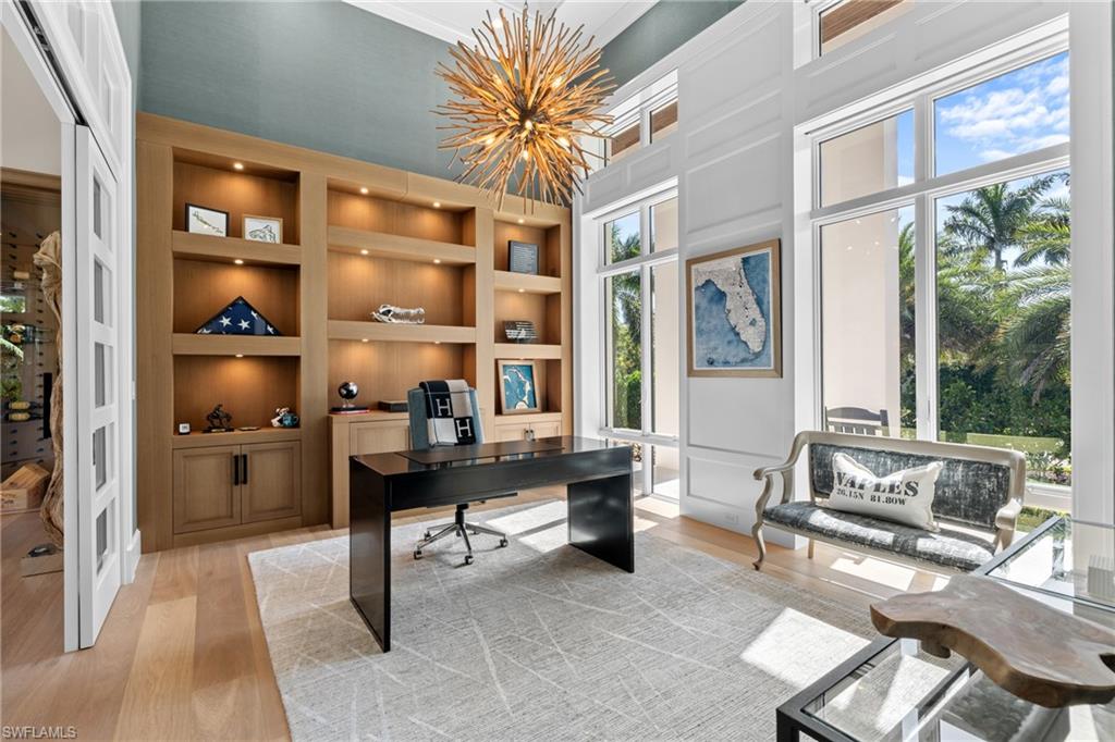 4511 Crayton Road Naples, FL 34103 - Photo 14 of 28 a view of a workspace with furniture and a window