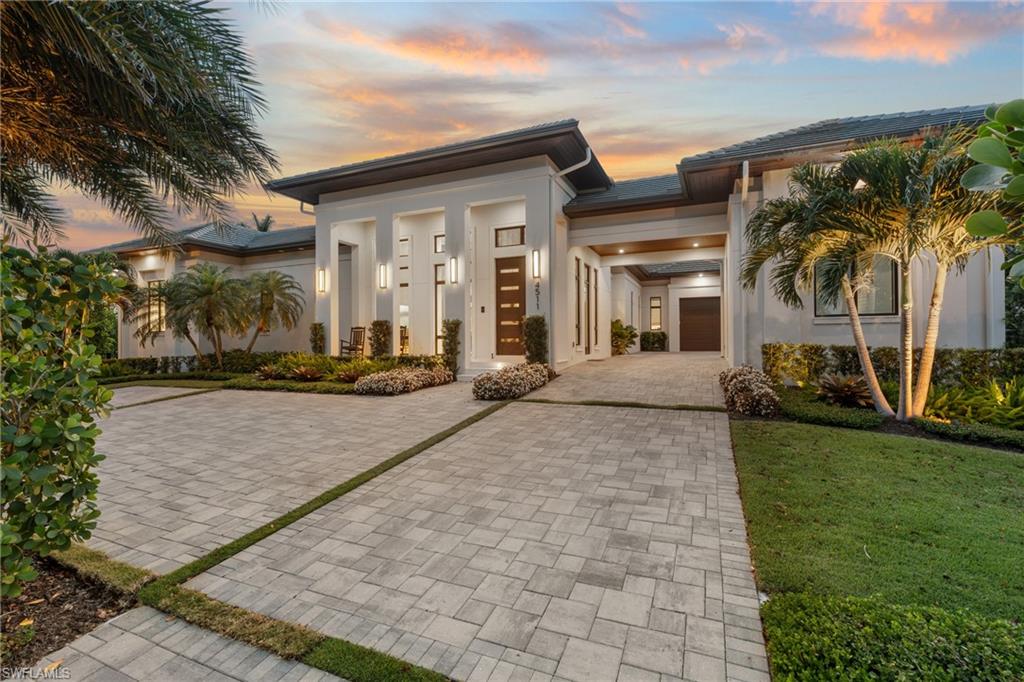 4511 Crayton Road Naples, FL 34103 - Photo 27 of 28 a view of a building with a outdoor space