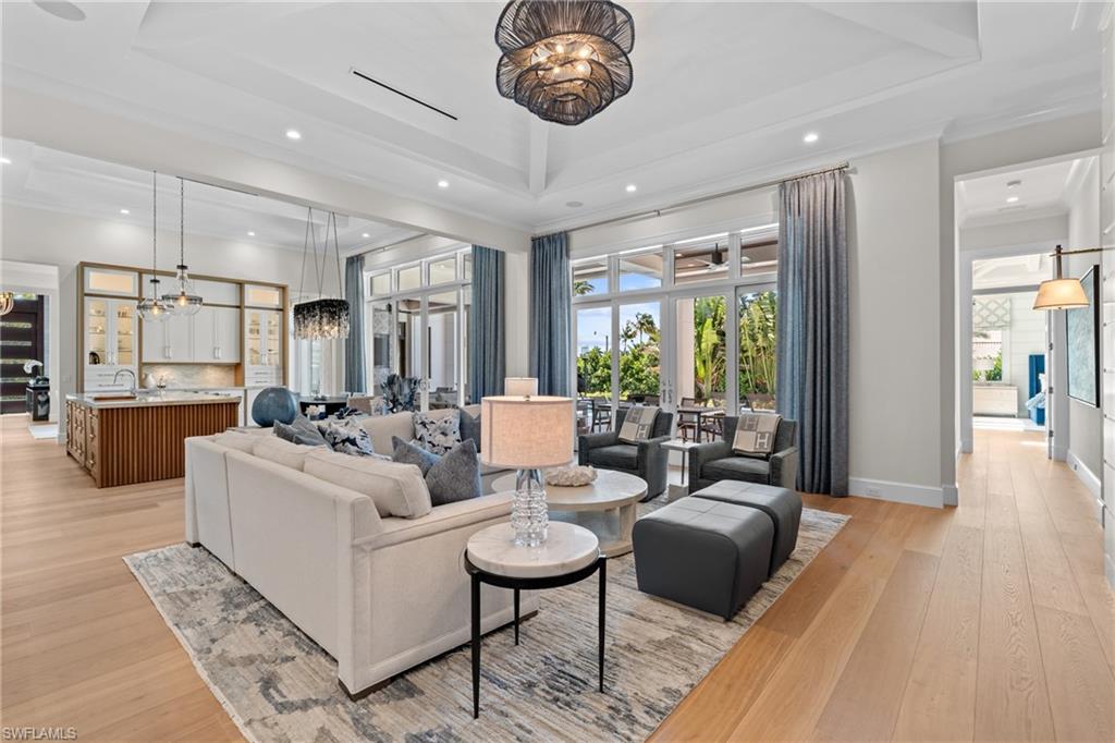 4511 Crayton Road Naples, FL 34103 - Photo 9 of 28 a living room with furniture and a large window
