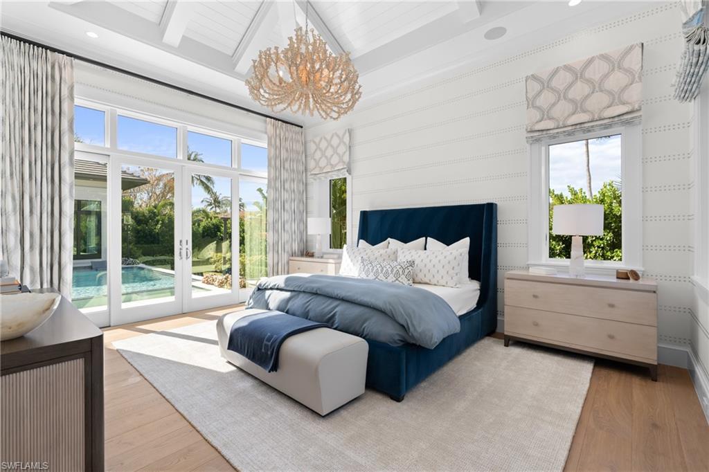 4511 Crayton Road Naples, FL 34103 - Photo 10 of 28 a bed room with a bed and a large window