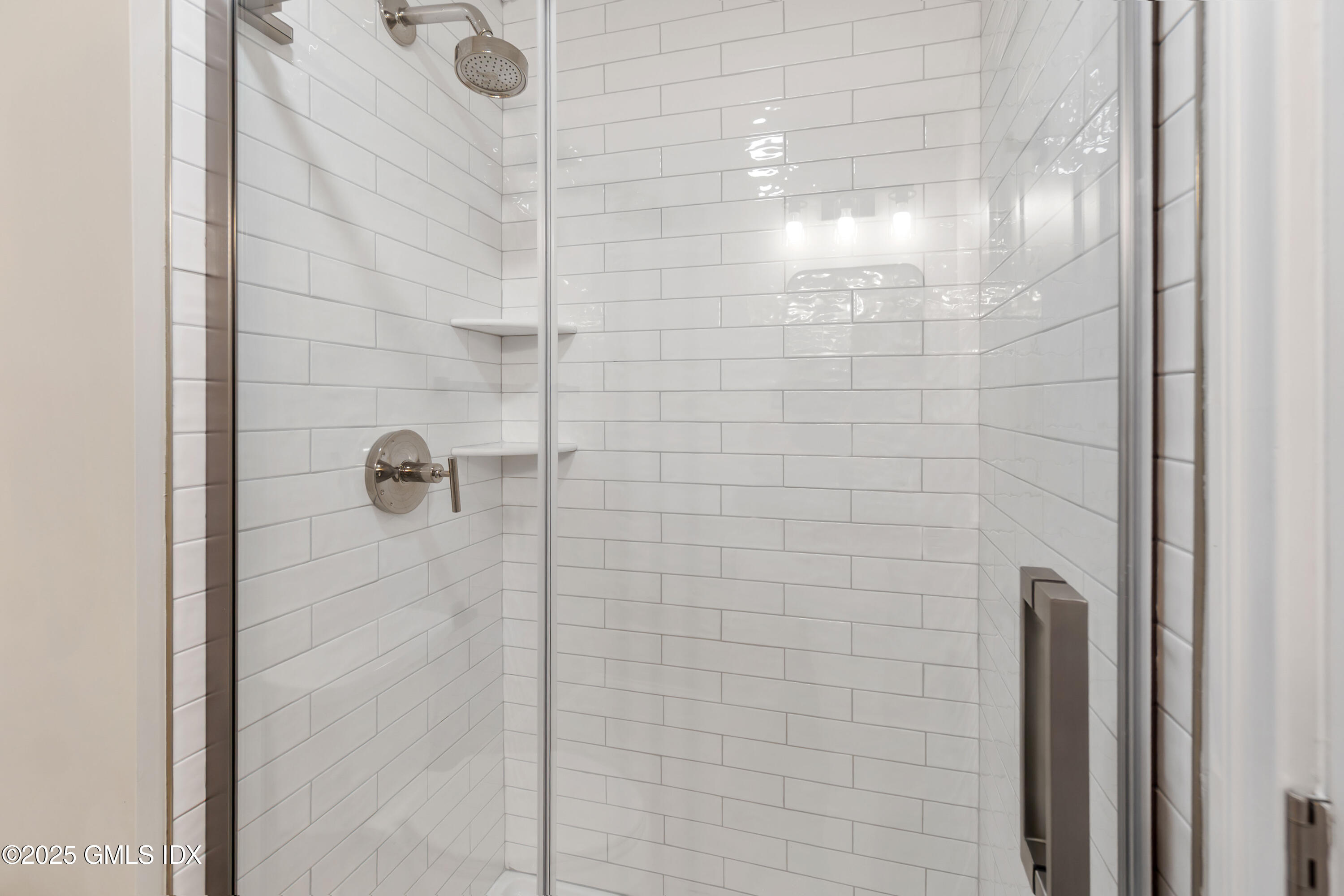 241 Weaver Street, Unit 12E Greenwich, CT 06831 - Photo 16 of 25 a bathroom with a shower