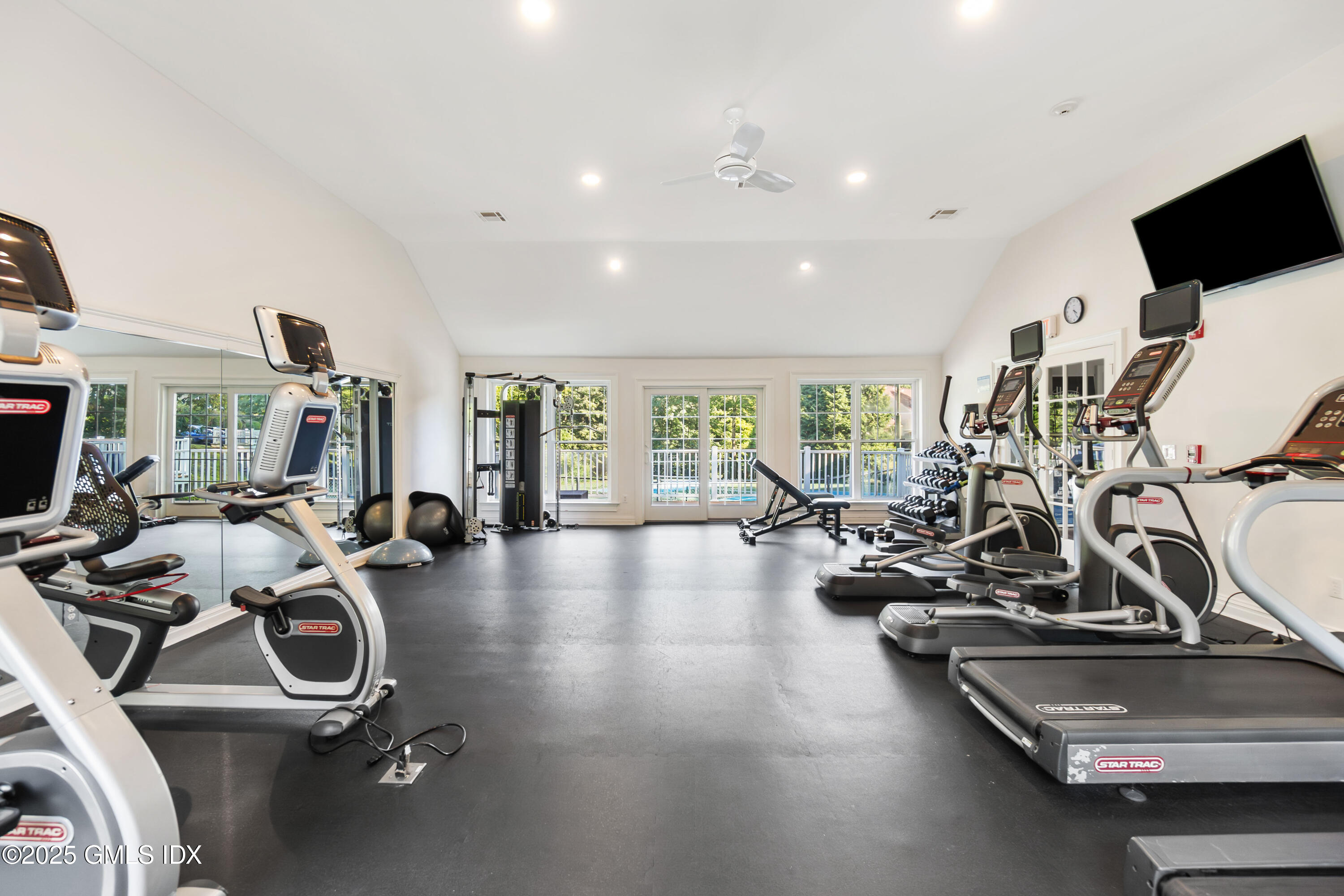 241 Weaver Street, Unit 12E Greenwich, CT 06831 - Photo 17 of 25 a view of a room with gym equipment