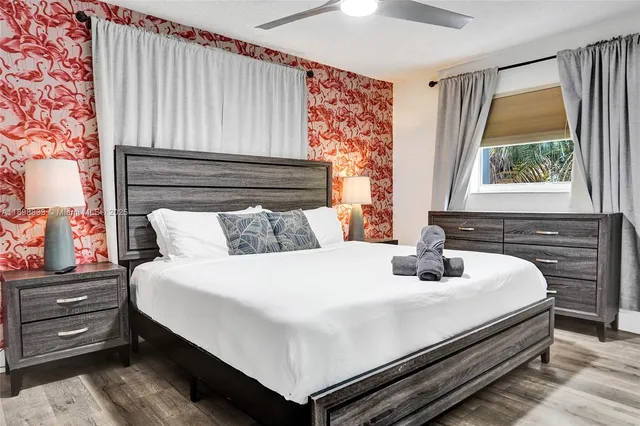 a bedroom with a bed and a window