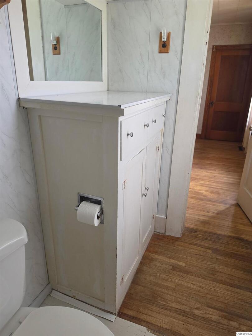 304 West 3rd Street Golden, IL 62339 - Photo 9 of 18 a view of bathroom with a sink and mirror