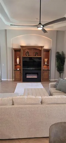 a living room with a couch and a fireplace
