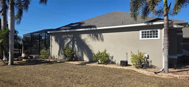 a view of backyard with wheel chair and potted plants
