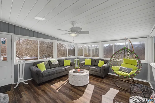 a living room with furniture and a large window