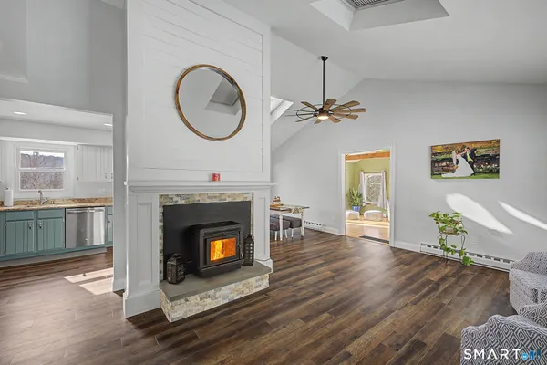 a living room with a fireplace and a fireplace