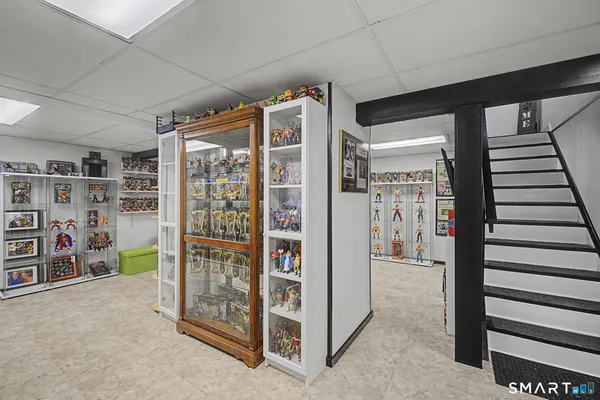 a view of a livingroom with furniture and toys