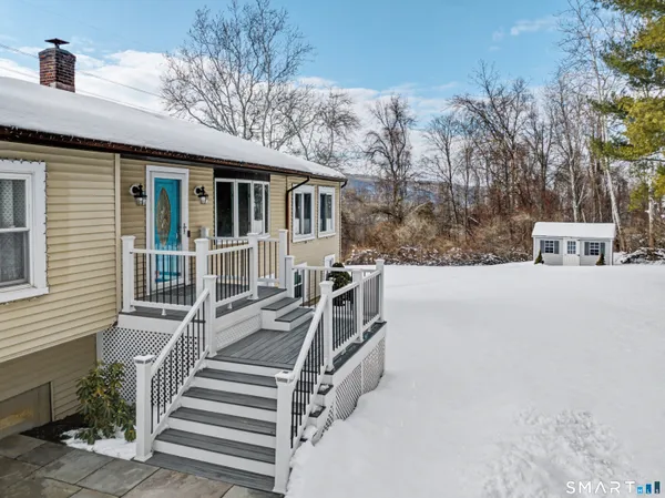 a view of balcony with wooden floor