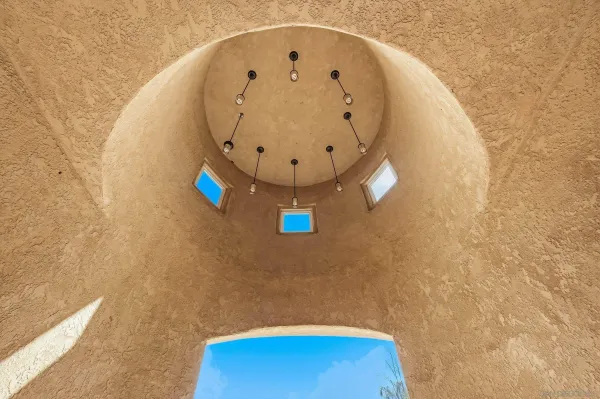 a kitchen with stainless steel appliances kitchen island granite countertop a table and chairs