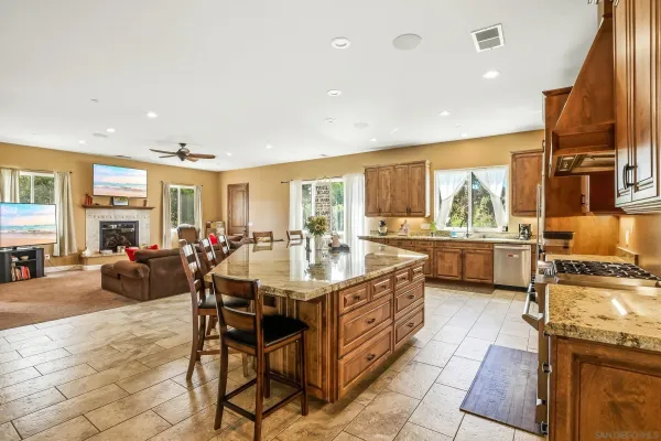 a bedroom with furniture and a large window