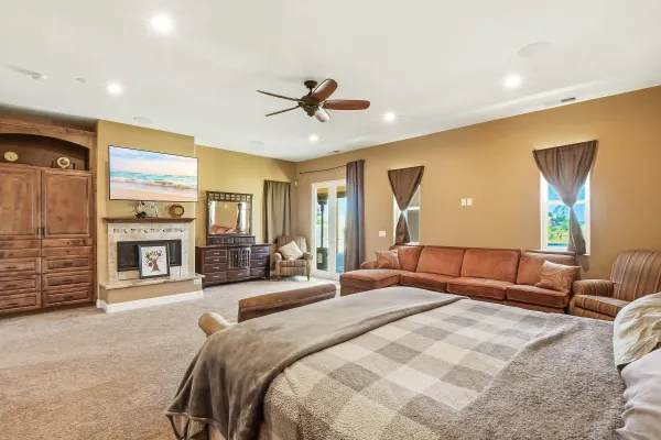 a bedroom with a bed and a chandelier