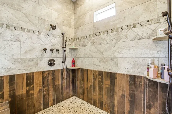 a bedroom with bed and window